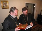 Archbishop Nikolae presents the Metropolitan Christopher with a hand-painted icon of Constantine & Elena