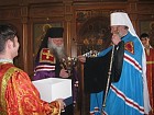 Met. Christopher presents Bishop Peter with a bowl to use for Holy Water